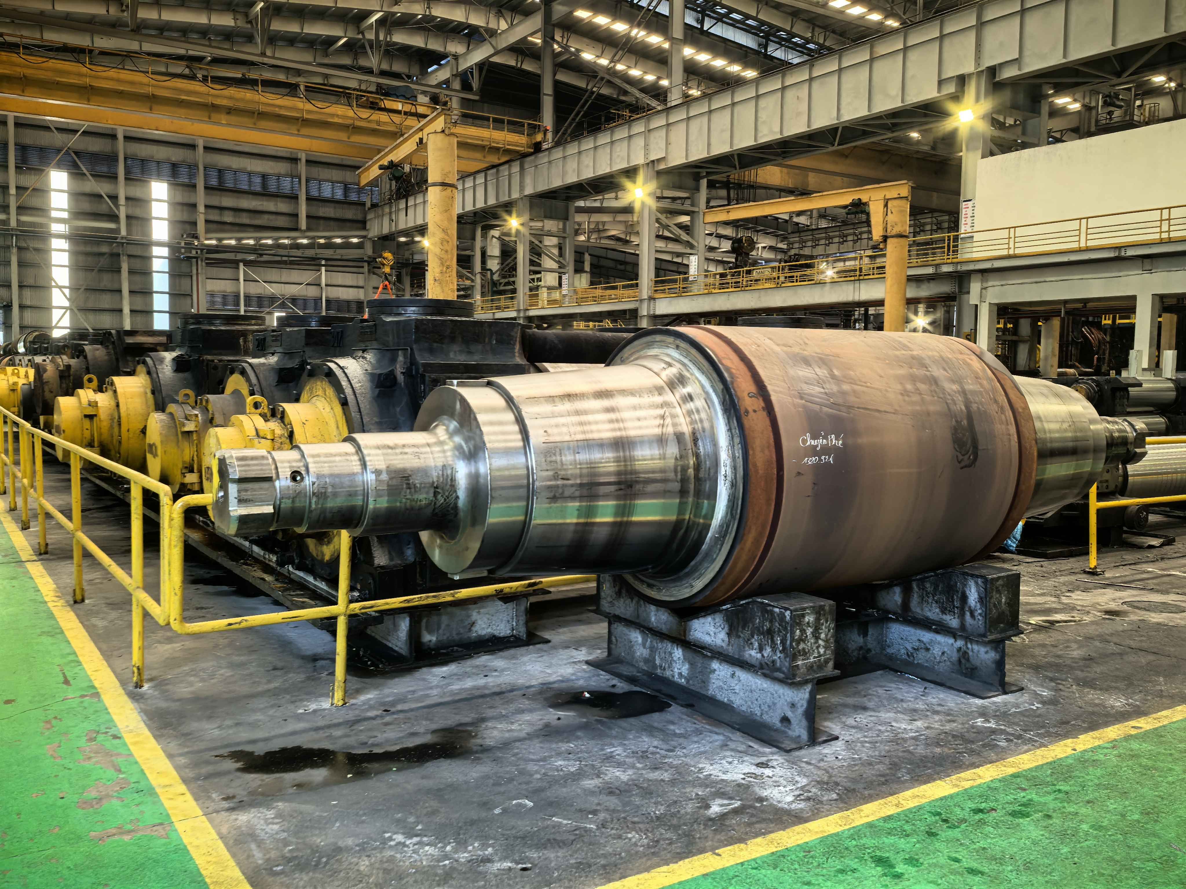 Close-up view of a steel roll with precise surface finish, ready for industrial use.